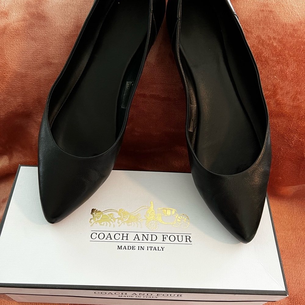 Black leather Coach and Four flats